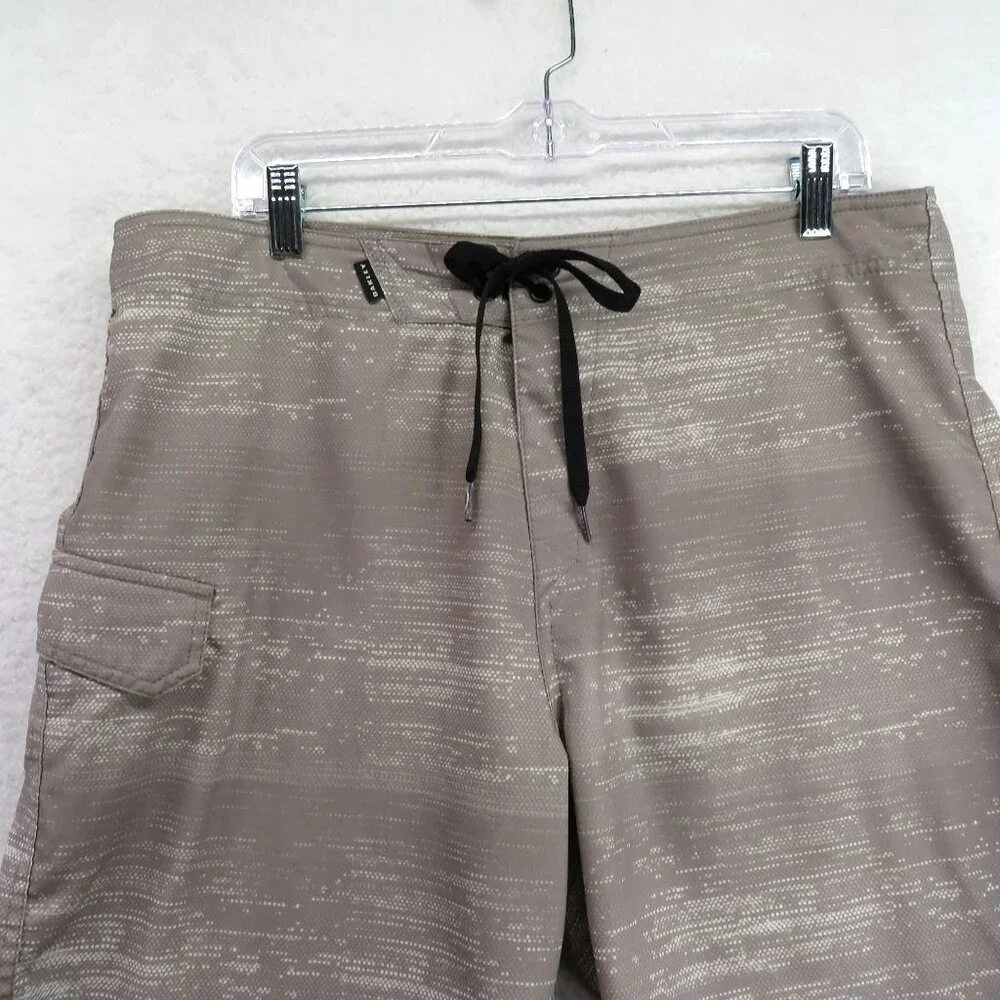 Oakley Swimsuit Mens Size 34 Beige Patterned Boardshorts Drawstring Waist Pocket